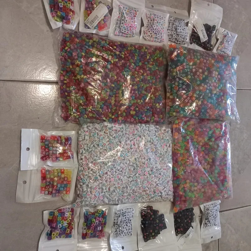 Colorful alphabet, heart and smiley beads in assorted packs