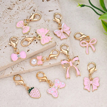 10-Piece Random Pink Bow Enamel Charms with Lobster Clasps